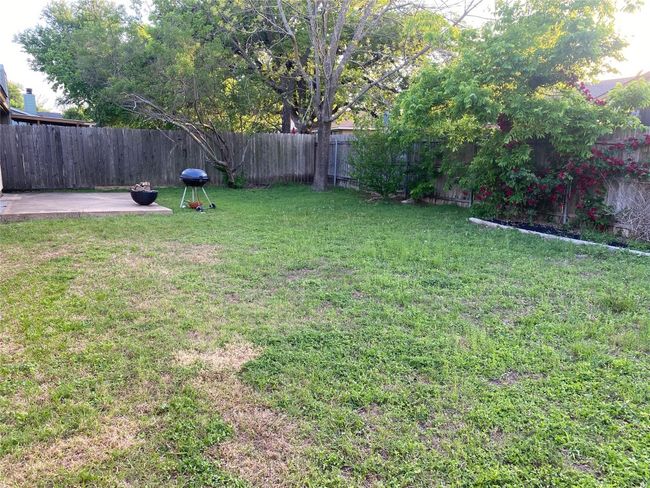 View of yard featuring a patio area and a fenced backyard | Image 29