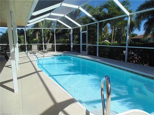 Pool featuring a lanai and a patio area | Image 31