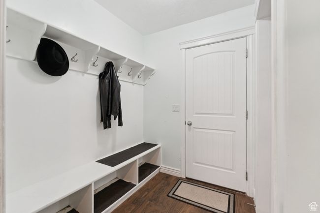 Mudroom featuring dark wood finished floors | Image 17