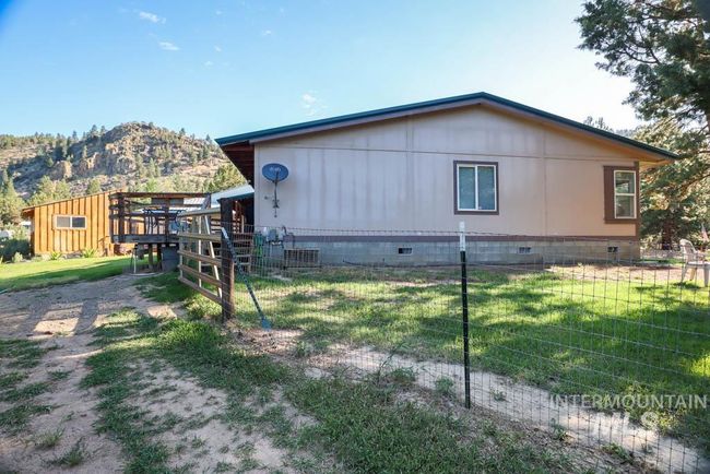 View of side of home featuring crawl space and a mountain view | Image 38