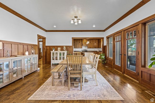 Dining area with french doors, ornamental molding, and dark wood-type flooring | Image 12
