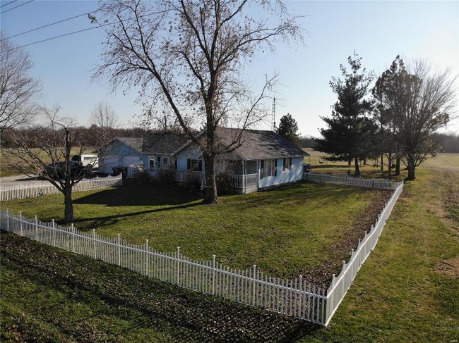 View of front of property with a garage and a front lawn | Image 4