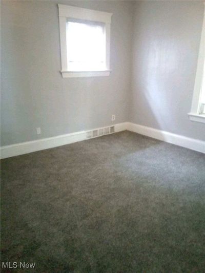 Spare room featuring carpet flooring | Image 2