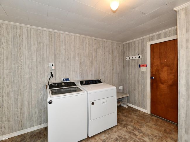 Large laundry room, door to righ leads to the garage | Image 18