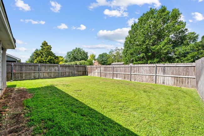 View of fenced backyard | Image 34