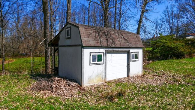 View of outdoor structure with an outbuilding | Image 36
