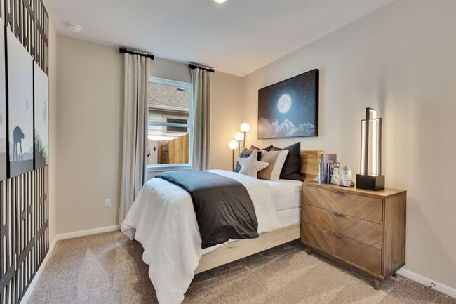 Bedroom with light carpet and baseboards | Image 8