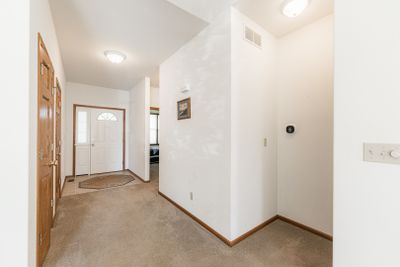 Looking to the front door from the living room | Image 3