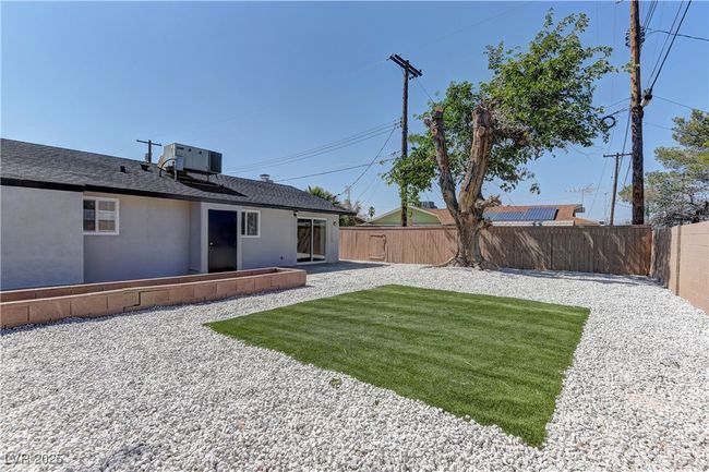 View of yard featuring central AC and a patio | Image 36