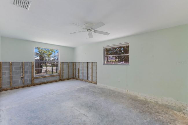 The primary suite has been enlarged and has an oversized new window for abundant natural light. | Image 16