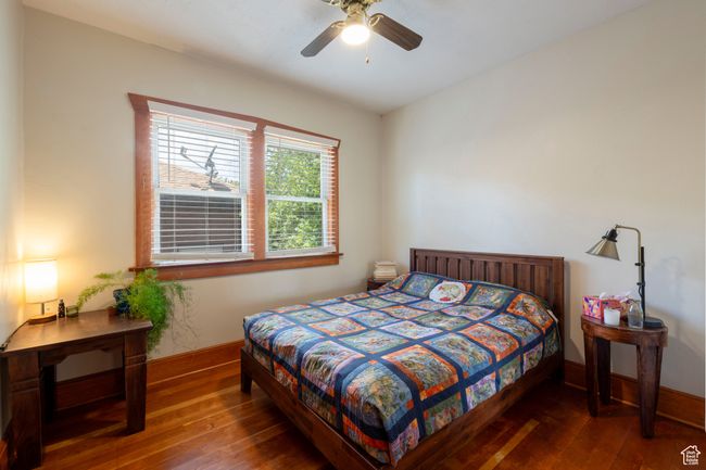 Bedroom with hardwood / wood-style flooring and a ceiling fan | Image 15