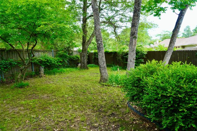 View of yard with a fenced backyard | Image 22
