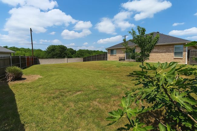 View of fenced backyard | Image 28