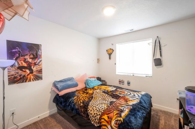 Bedroom with carpet floors and baseboards | Image 10
