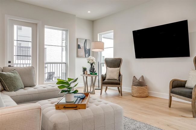 Living room featuring baseboards, light wood finished floors, and recessed lighting | Image 8