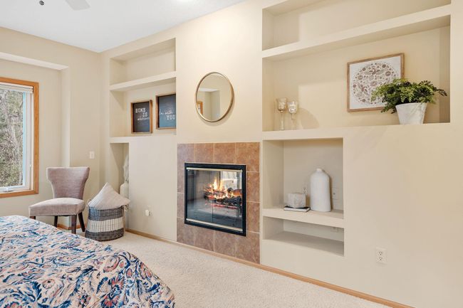 Double sided fireplace in primary suite | Image 39