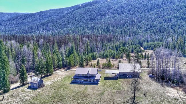 Birds eye view of property featuring a view of trees and a mountain view | Image 47