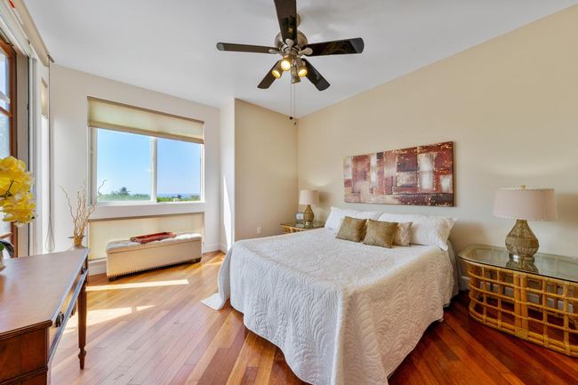 Primary looking towards the bay window that has ocean views. | Image 21