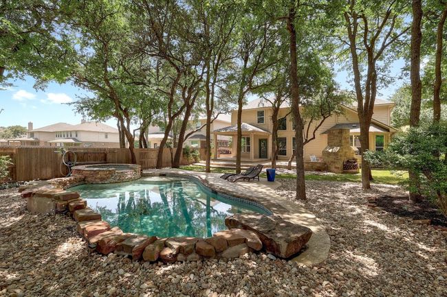 What if your backyard felt like a vacation every day? With mature trees surrounding a stunning pool and spa, this private oasis is the perfect blend of luxury and tranquility | Image 36