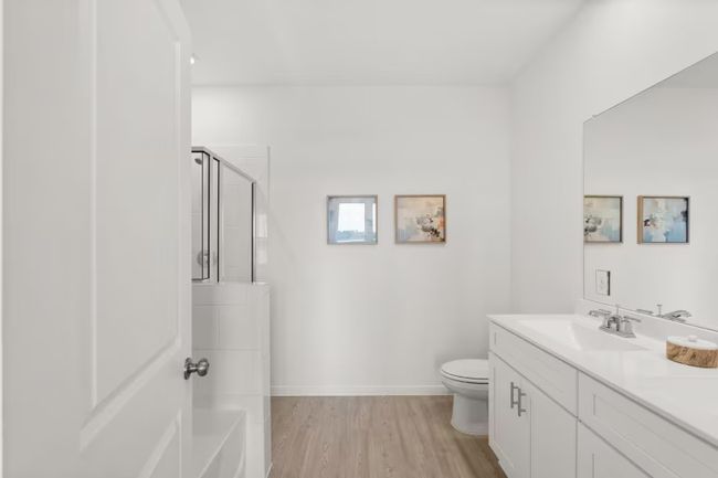 Photo of Pulte model home with same floor plan, not of actual home listed. | Image 9