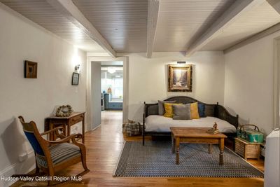 Living Room with antique beams and newer hardwood floors | Image 3