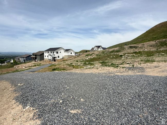 View of dirt / gravel road featuring a residential view | Image 4