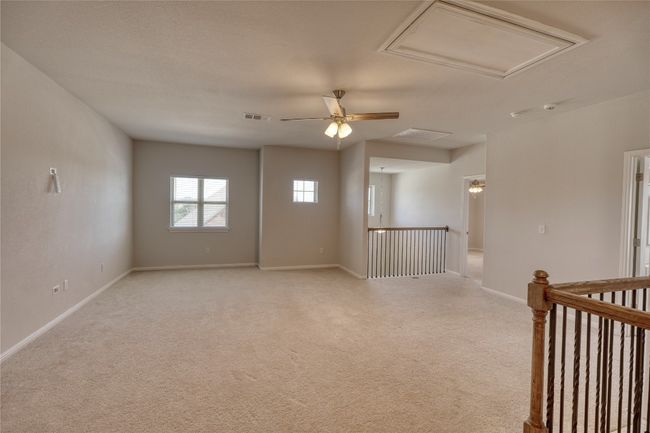 Spare room with visible vents, light colored carpet, attic access, and baseboards | Image 24