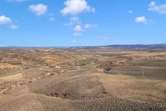 Aerial view of sparsely populated area with mountains | Image 22