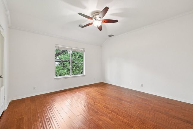 Natural light and wood flooring continue throughout each upstairs bedroom. | Image 26