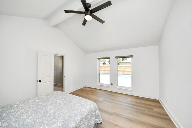 Primary bedroom with view to the pool | Image 34