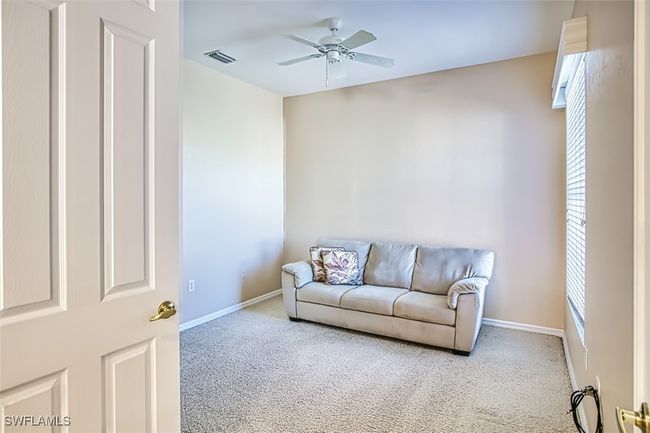 Living room featuring carpet floors and ceiling fan | Image 35