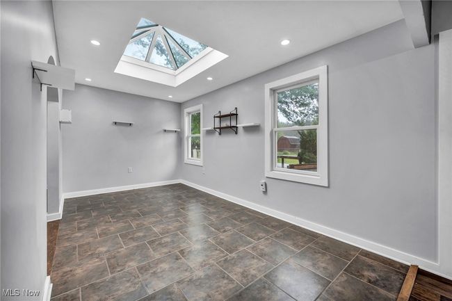 Unfurnished room featuring a skylight and recessed lighting | Image 12