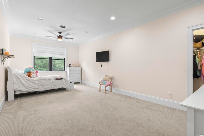 Bedroom with ornamental molding, carpet floors, recessed lighting, baseboards, and ceiling fan | Image 22