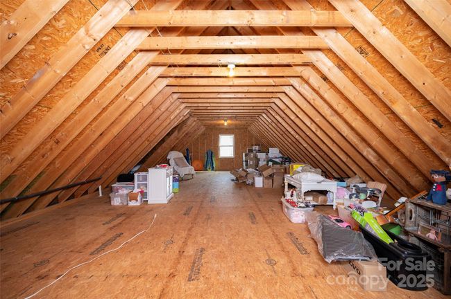Walk-in Attic Storage above the 3-car garage is wired for future expansion. | Image 29