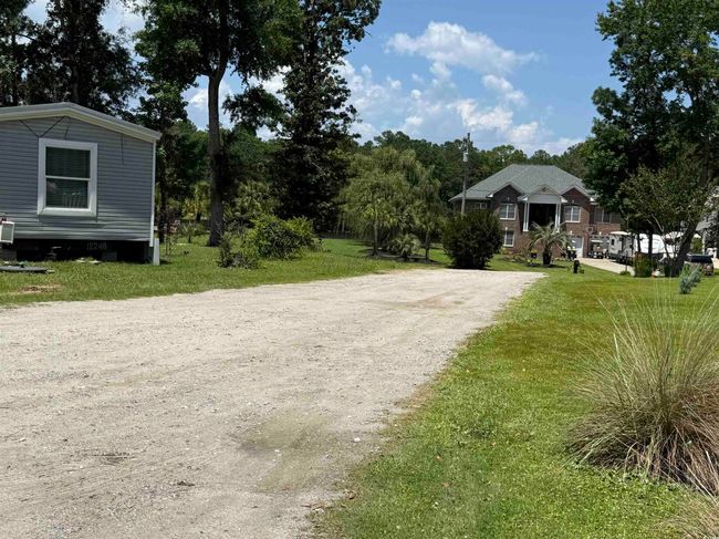 View of dirt / gravel road | Image 15