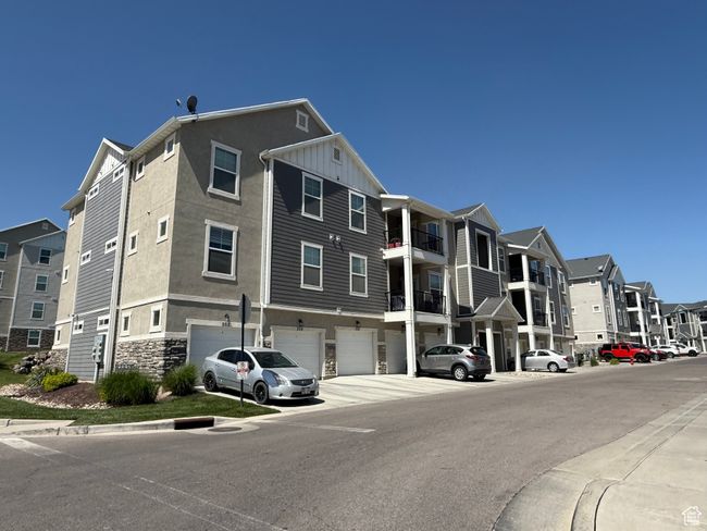 View of property with a garage and a residential view | Image 32