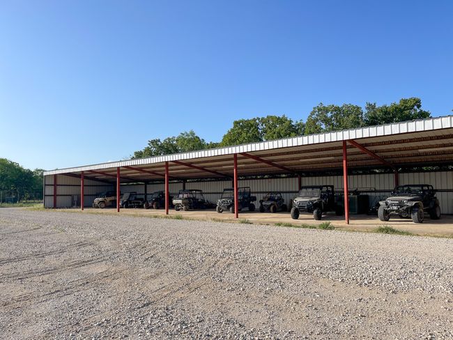 View of vehicle parking featuring a detached​​‌​​​​‌​​‌‌​‌‌​​​‌‌​​‌‌​‌​​​​​‌ carport | Image 7