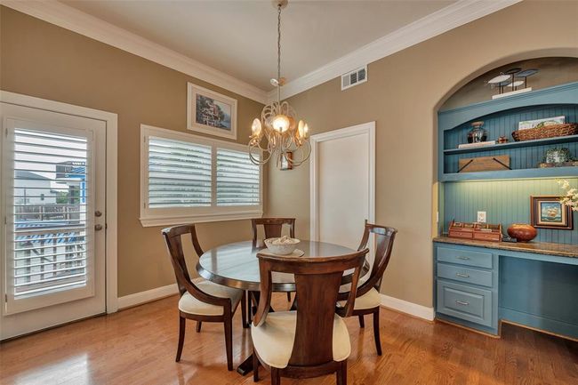 Breakfast area has access to the walk in pantry and built in desk. | Image 24