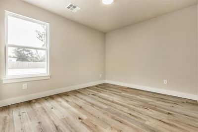 Spare room with light hardwood / wood-style floors and plenty of natural light | Image 2