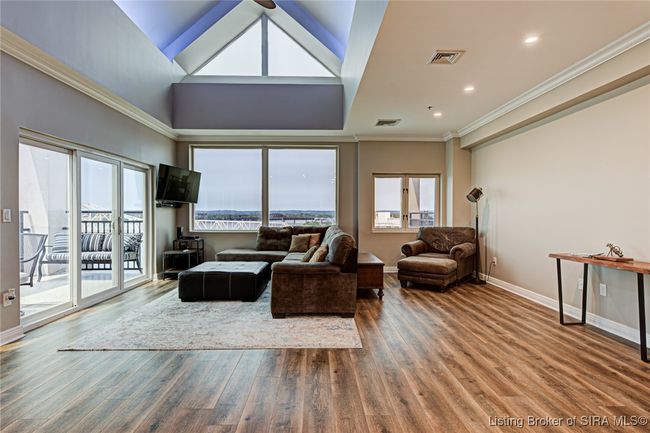 living room with lighted vaulted ceiling | Image 5