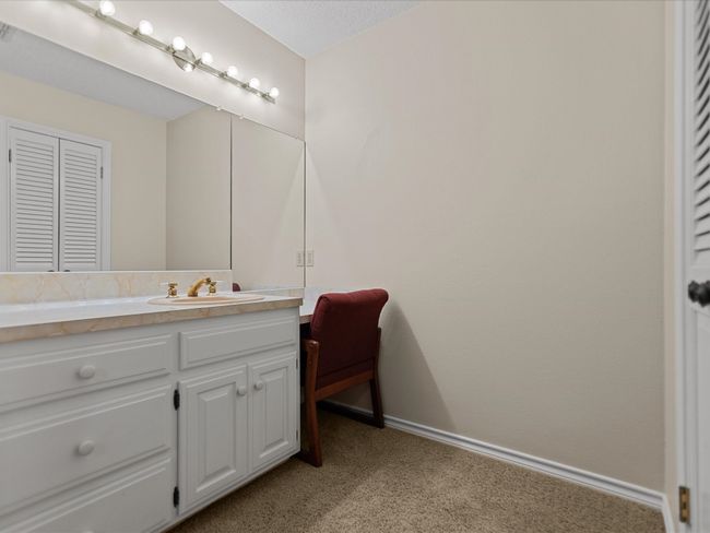Bathroom 3 featuring vanity, baseboards, and a closet | Image 33