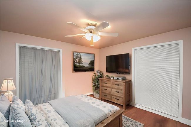 Bedroom 2 is a nice size, featuring plenty of space for any family member or guest. | Image 15