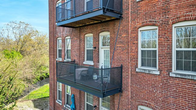 exterior space featuring brick siding and fence | Image 21
