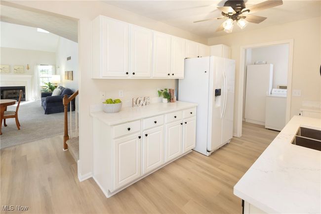 The refreshed kitchen offers quartz counters, undermount double sink and room to prepare meals! | Image 14