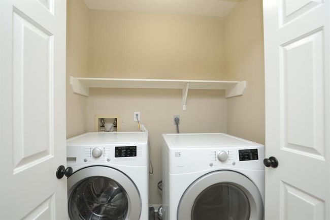 View of upstairs laundry center - washer/dryer included. | Image 21
