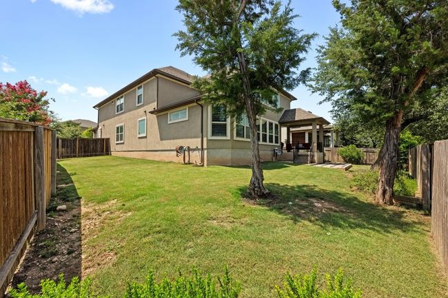Back of house featuring stucco siding and a fenced backyard | Image 36