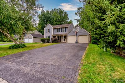 UPDATED FOUR BEDROOM COLONIAL WITH A NEW MODERN EXPANDED KITCHEN, 2000 SQ FT WITH A FINISHED LOWER LEVEL. HARDWOODS ON THE ENTIRE FIRST FLOOR! GREAT HOME MUST SEE FOR YOURSELF! | Image 1