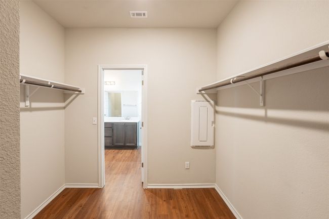 Spacious closet featuring visible vents, a sink, and wood finished floors | Image 28
