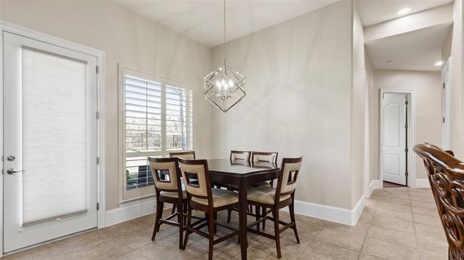 Breakfast room keeps the family together with an adjoining kitchen and family room area. | Image 25