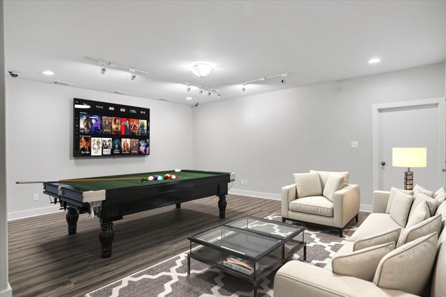 Rec room with rail lighting, dark wood-type flooring, and billiards | Image 7